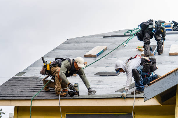Professional Gutter Installation technician working in Warren, MA